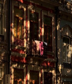 Laundry drying on a balcony of an old Porto house