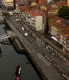 The Ribeira from above, a rabelo boat on the Douro